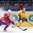 MINSK, BELARUS - MAY 13: Sweden's Joakim Lindstrom #12 stickhandles the puck away from Norway's Stefan Espeland #17 during preliminary round action at the 2014 IIHF Ice Hockey World Championship. (Photo by Richard Wolowicz/HHOF-IIHF Images)

